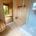timber frame sauna interior with shower
